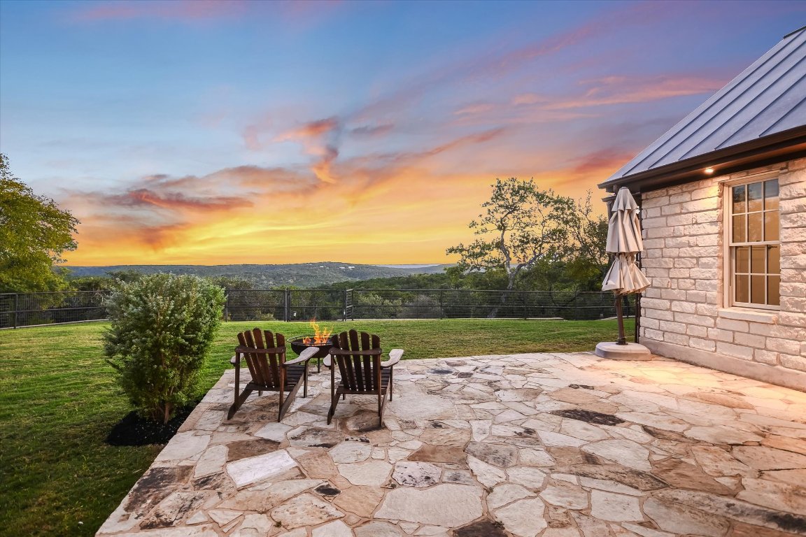1050 River Mountain Road, Unit A Wimberley, TX 78676 - Photo 24 of 40 a view of a backyard with plants and lake view