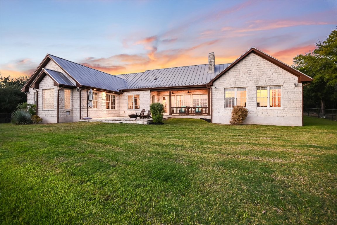 1050 River Mountain Road, Unit A Wimberley, TX 78676 - Photo 30 of 40 a front view of house with garden