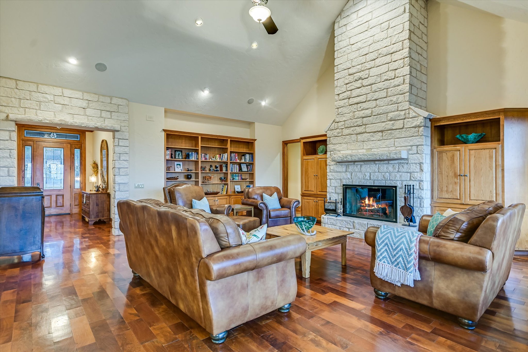 1050 River Mountain Road, Unit A Wimberley, TX 78676 - Photo 7 of 40 a living room with furniture and a fireplace