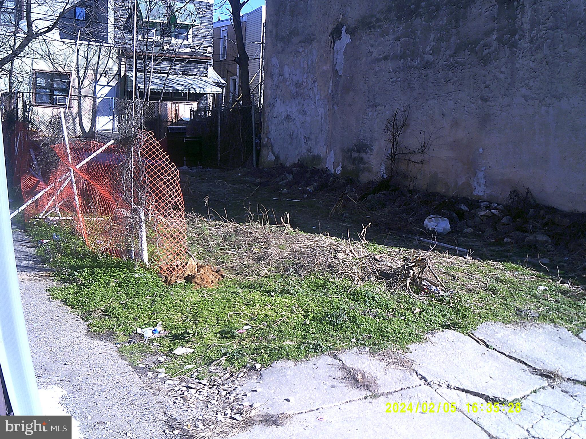 2015 Granite Street Philadelphia, PA 19124 - Photo 4 of 5 a backyard of a house with lots of green space and trees