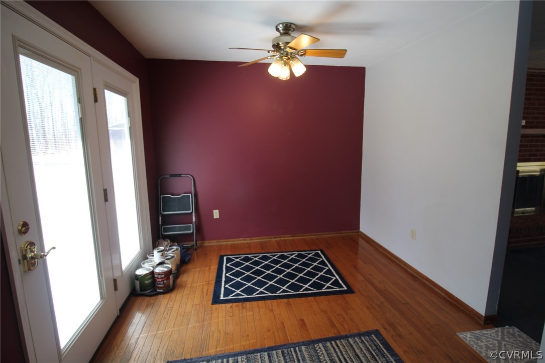 5053 Bell Road Dillwyn, VA 23936 - Photo 11 of 29 wooden floor in an empty room with a window