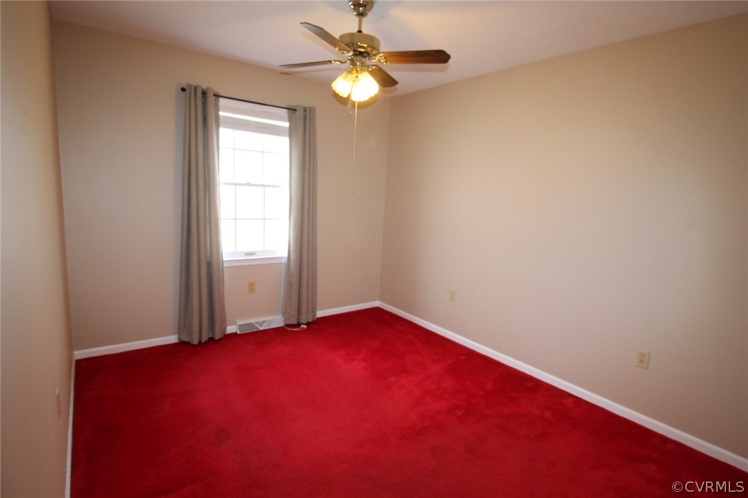 5053 Bell Road Dillwyn, VA 23936 - Photo 19 of 29 an empty room with windows and fan