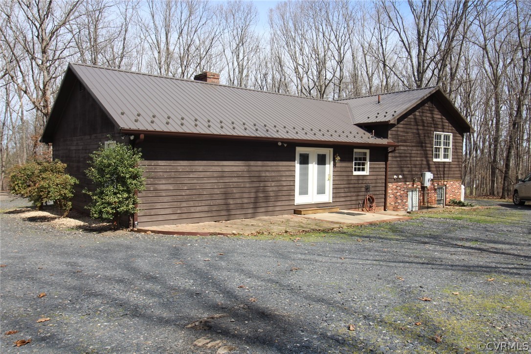5053 Bell Road Dillwyn, VA 23936 - Photo 22 of 29 a front view of a house with a yard and garage