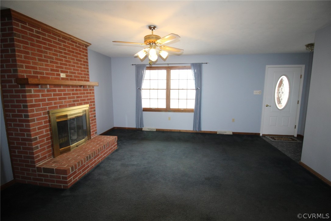 5053 Bell Road Dillwyn, VA 23936 - Photo 5 of 29 a view of a livingroom with a fireplace