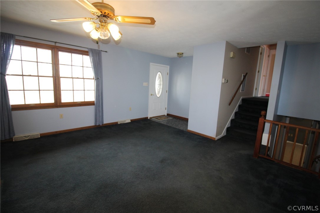 5053 Bell Road Dillwyn, VA 23936 - Photo 6 of 29 an empty room with windows and entrance