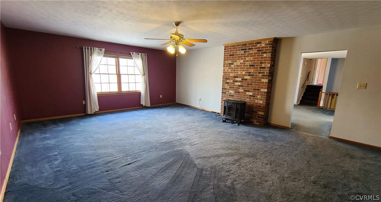 5053 Bell Road Dillwyn, VA 23936 - Photo 7 of 29 an empty room with windows and natural light