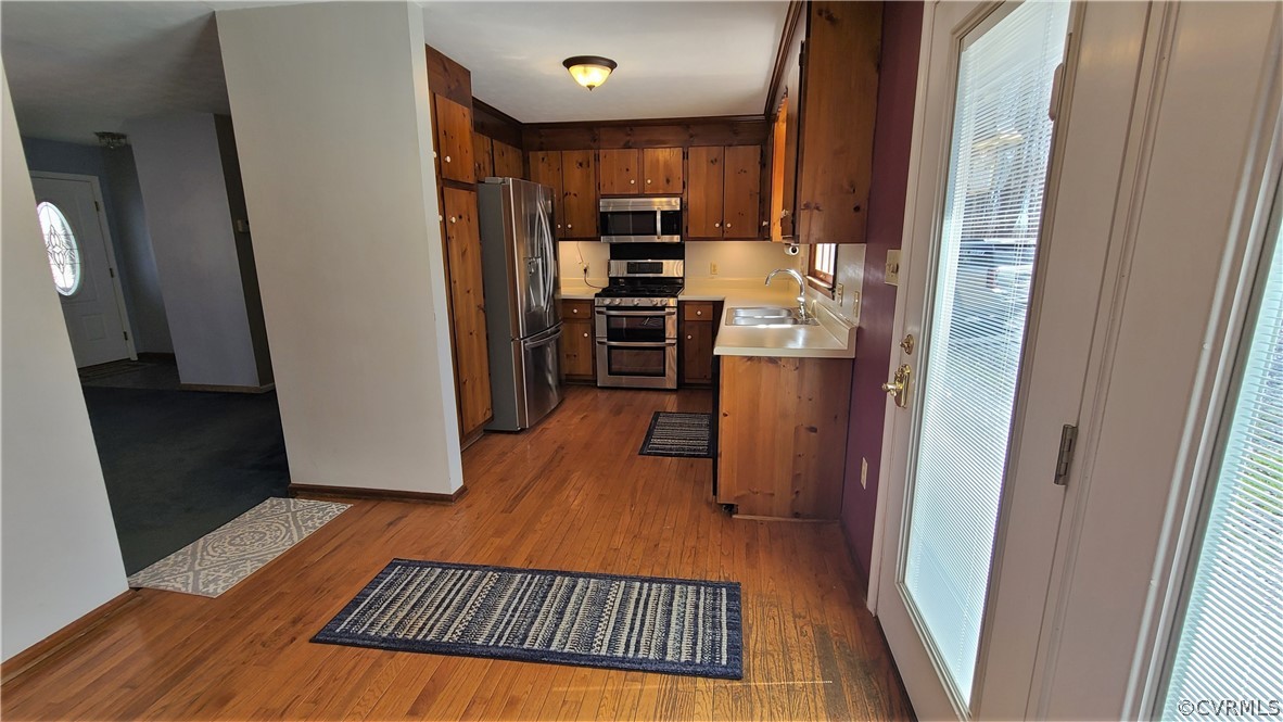 5053 Bell Road Dillwyn, VA 23936 - Photo 9 of 29 a kitchen with a refrigerator and a stove top oven