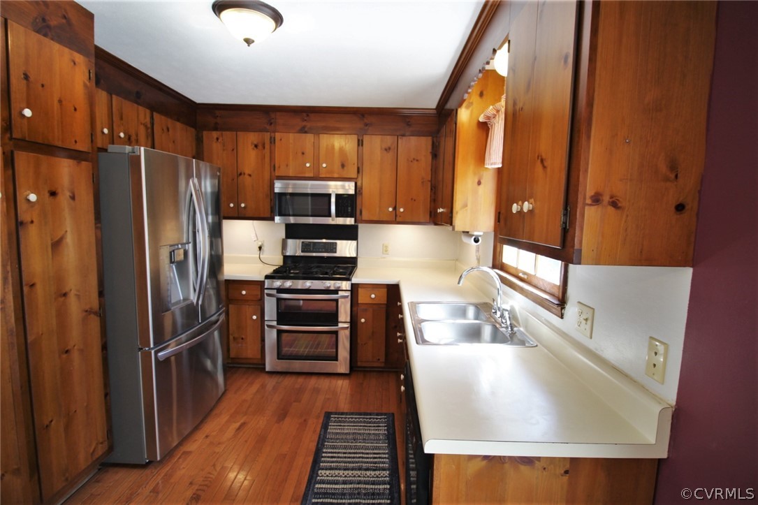 5053 Bell Road Dillwyn, VA 23936 - Photo 10 of 29 a kitchen with stainless steel appliances granite countertop a refrigerator a stove and a sink with wooden floors