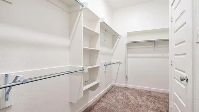 a view of an empty walk in closet