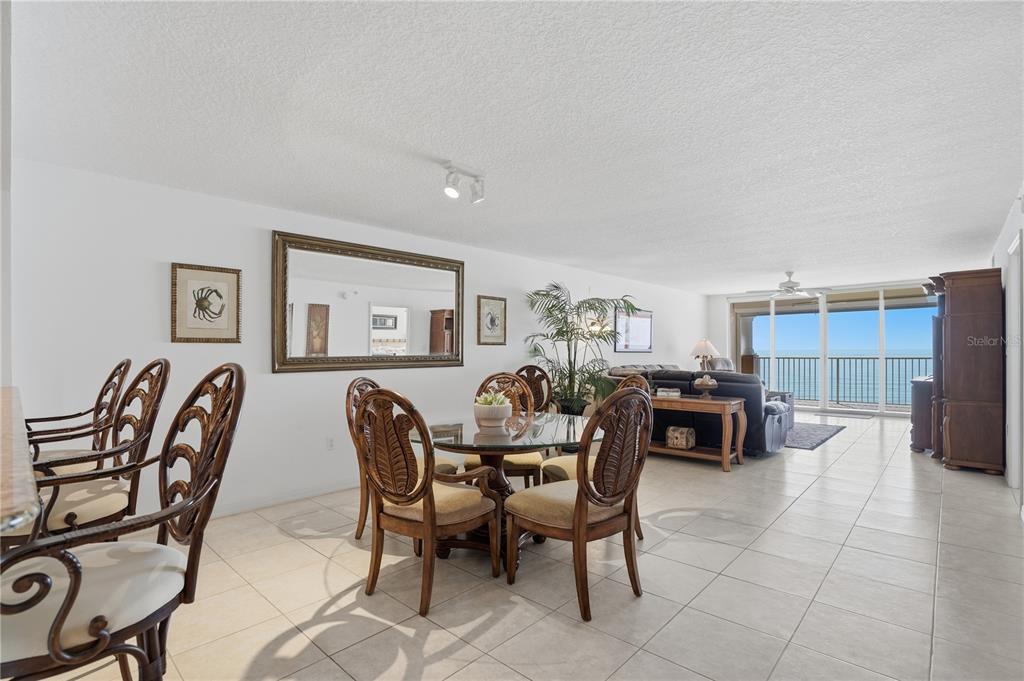 16326 Gulf Boulevard, Unit 307 Redington Beach, FL 33708 - Photo 11 of 43 a dining room with furniture and window
