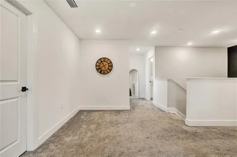 a bedroom with a bed and a television