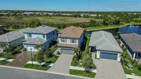 an aerial view of a house with a swimming pool yard and outdoor seating