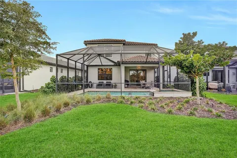 a front view of a house with a yard table and chairs