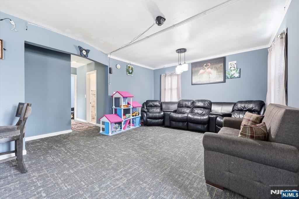 409 Tryon Avenue Englewood, NJ 07631 - Photo 5 of 33 a living room with furniture and a couch