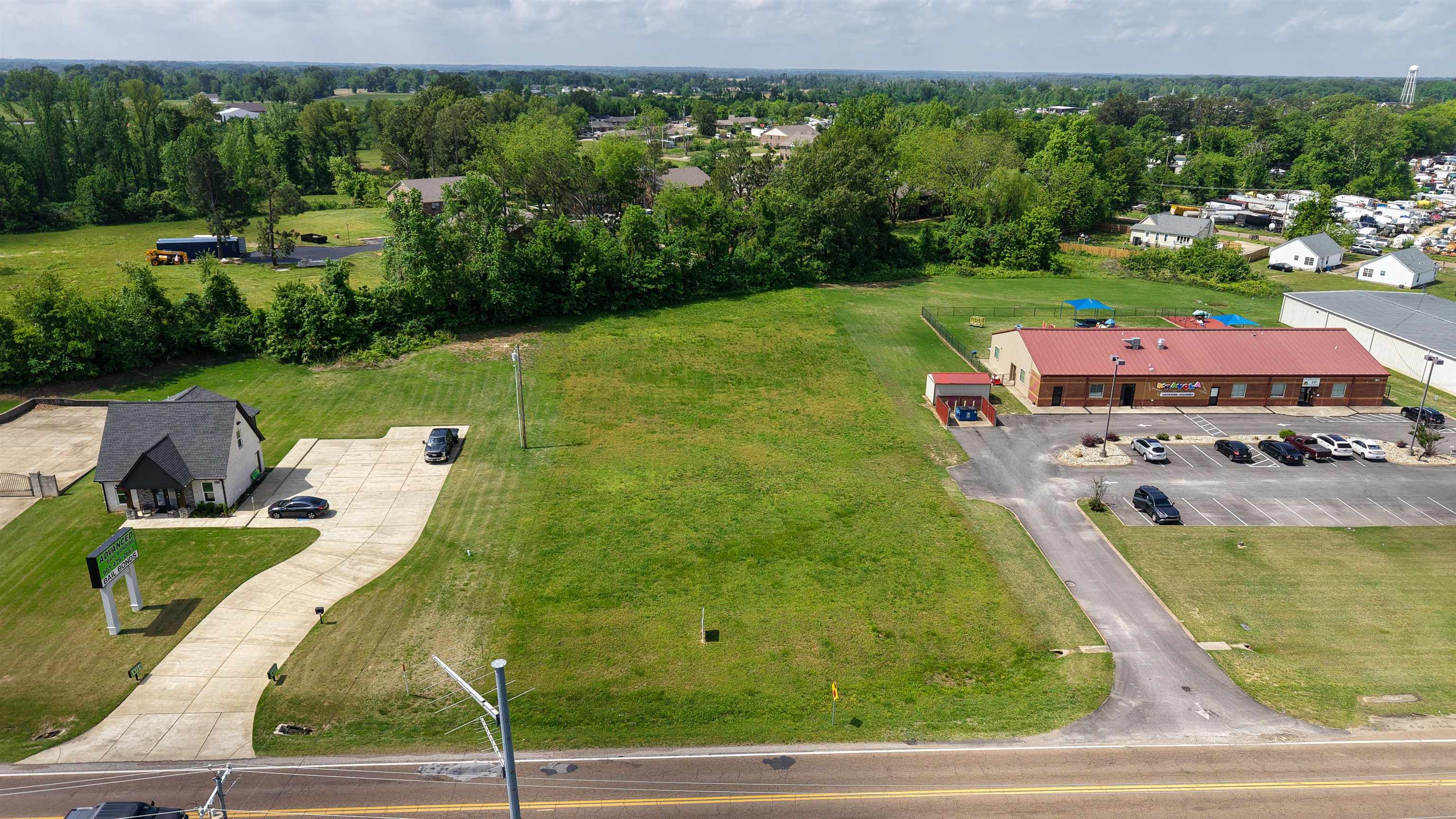 an aerial view of a house with yard patio and outdoor seating