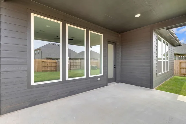 a view of a house with a yard and garage