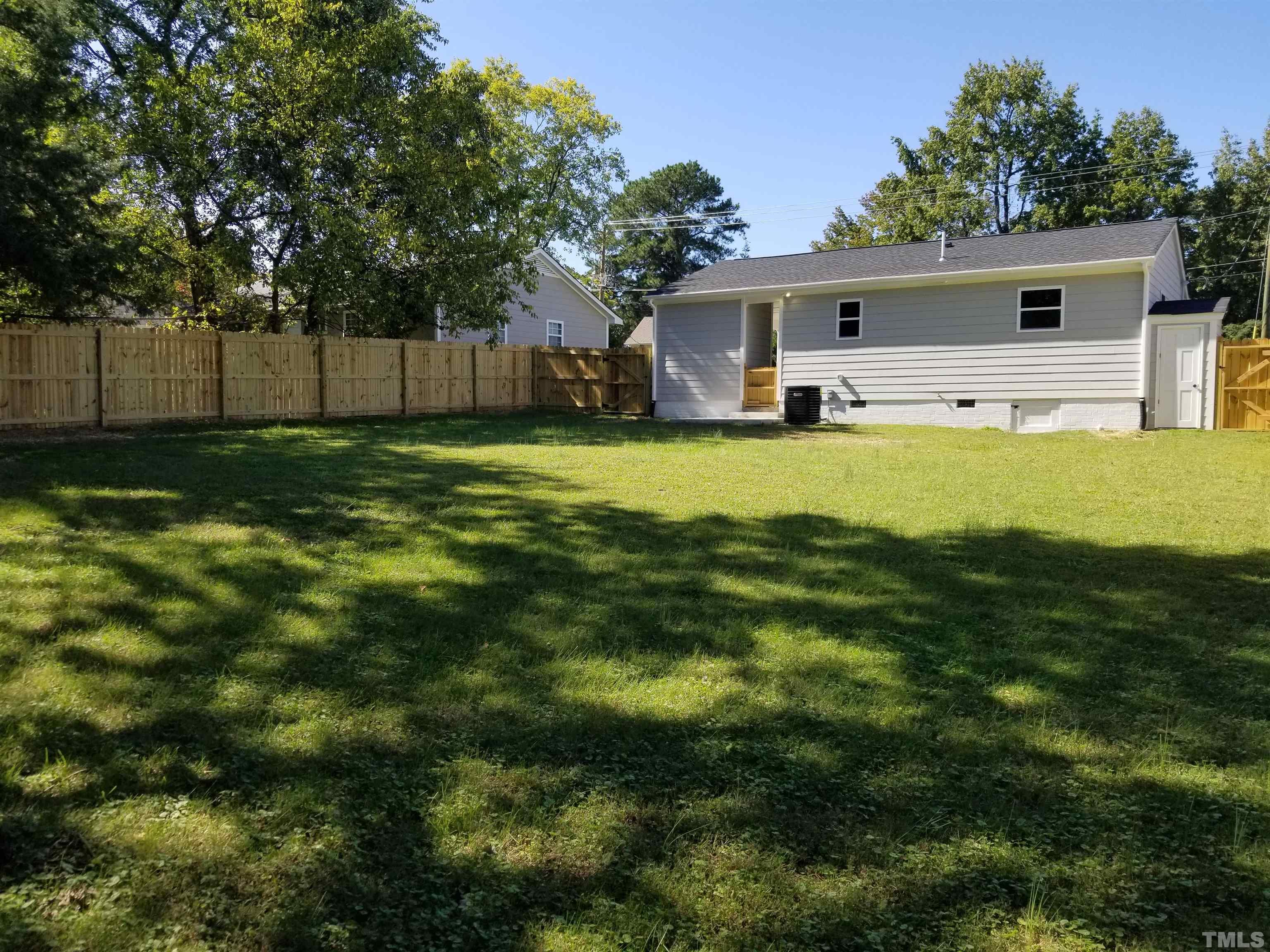 1706 Capps Street Durham, NC 27707 - Photo 27 of 31 a front view of house with yard and green space