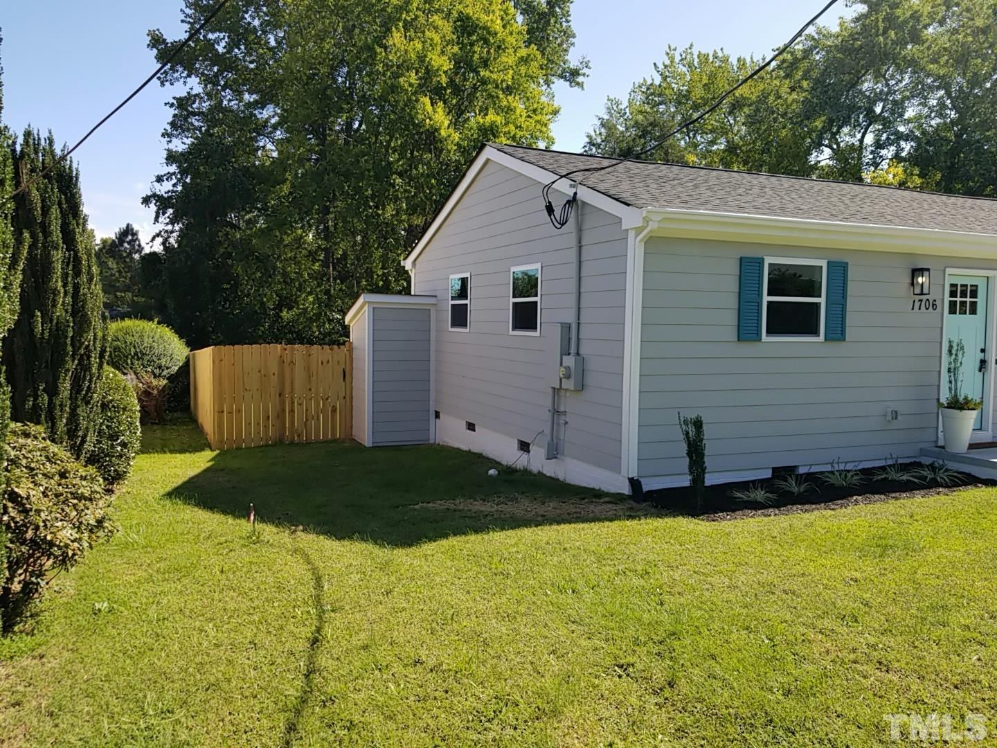 1706 Capps Street Durham, NC 27707 - Photo 28 of 31 a view of a backyard with plants and large tree