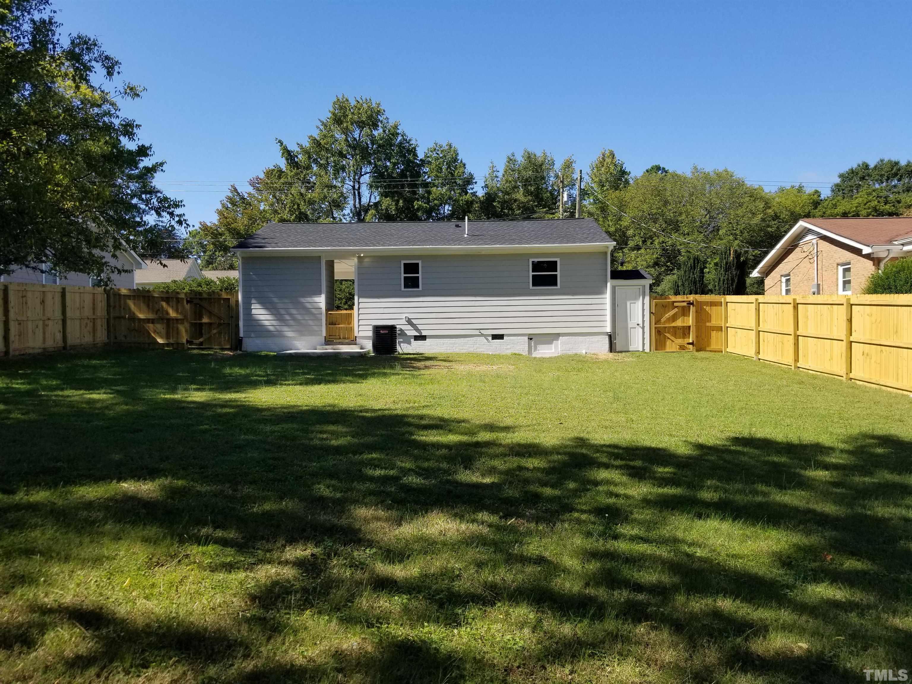 1706 Capps Street Durham, NC 27707 - Photo 29 of 31 a view of a house with a yard