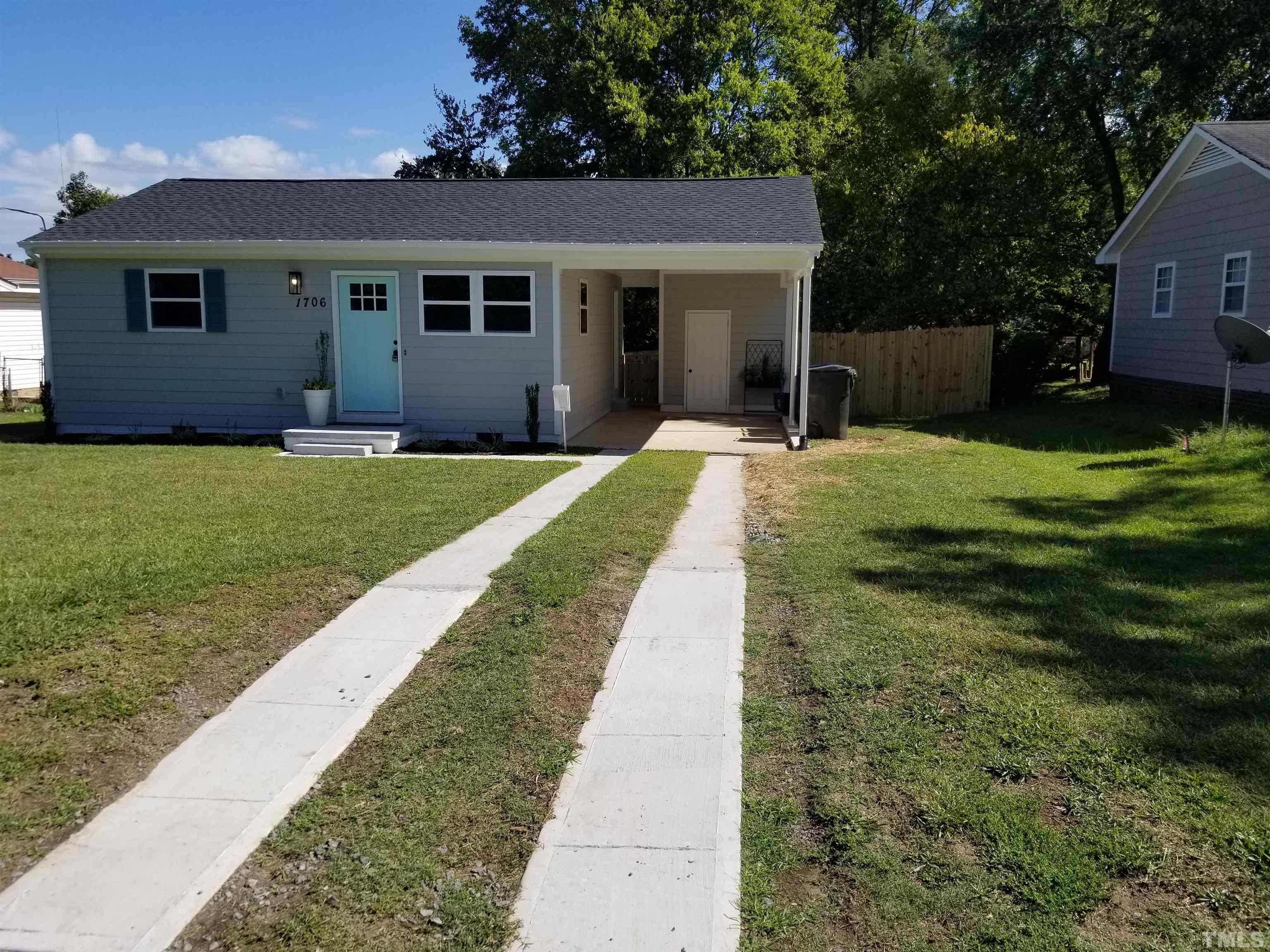 1706 Capps Street Durham, NC 27707 - Photo 3 of 31 a front view of a house with a yard