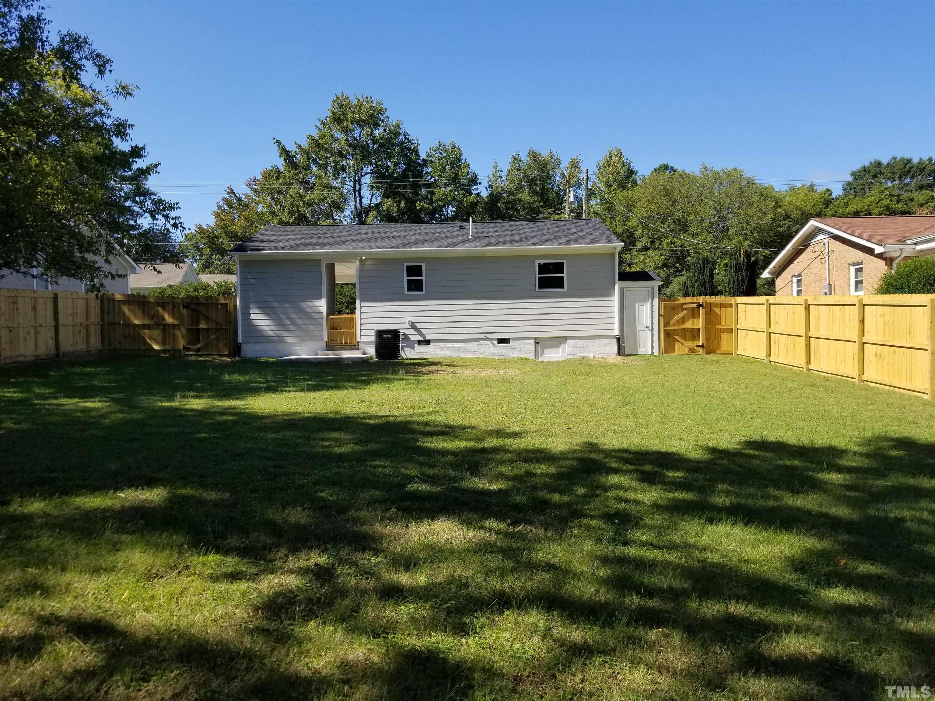1706 Capps Street Durham, NC 27707 - Photo 31 of 31 a view of a house with a yard