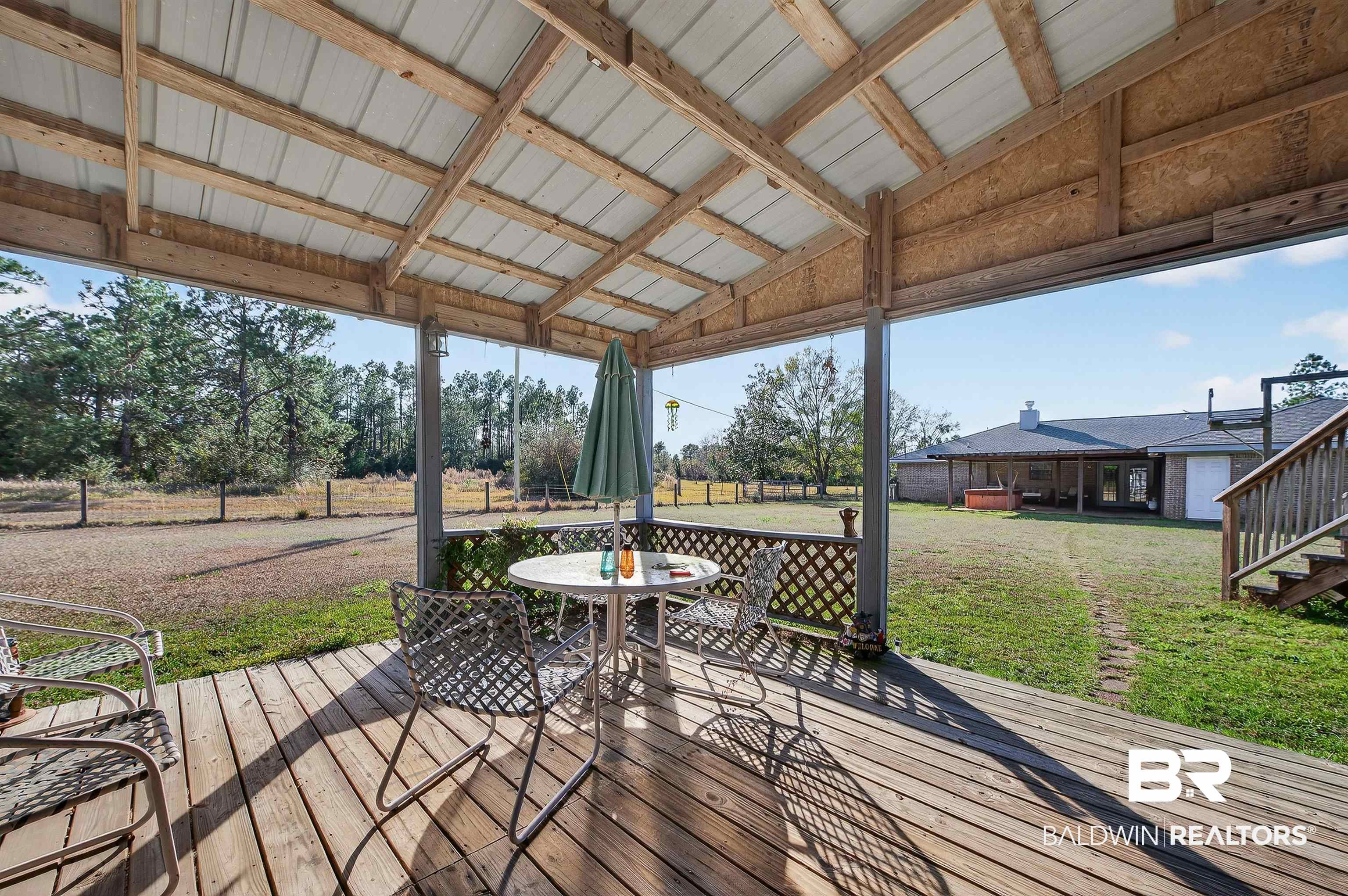 29635 Gardner Road Elberta, AL 36530 - Photo 45 of 66 Wooden terrace with a lawn and outdoor dining area