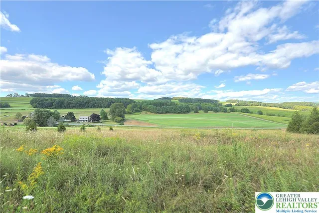 a view of a lake with a big yard