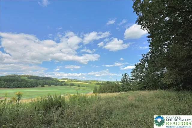 a view of a lake with a yard