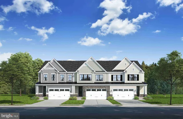 a view of house with yard and green space