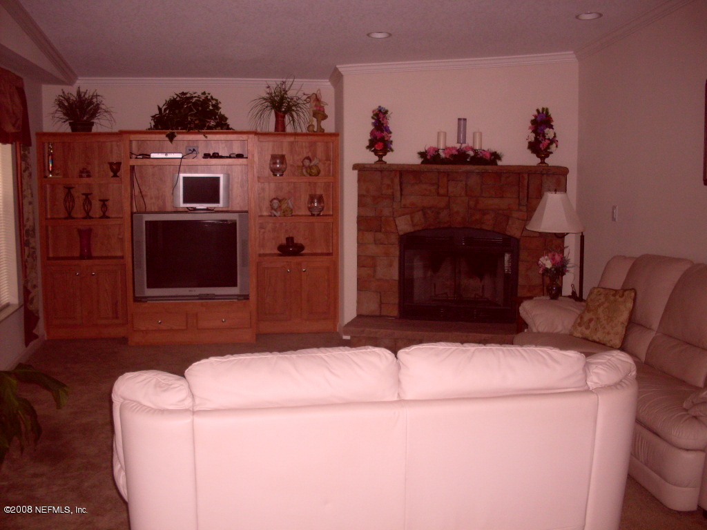 694 Dave Brown Road St. George, GA 31562 - Photo 11 of 19 Den with fireplace