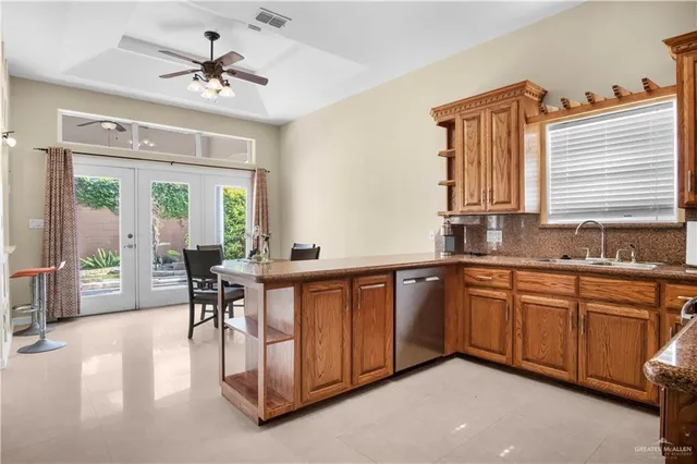 a very nice looking kitchen with a large window