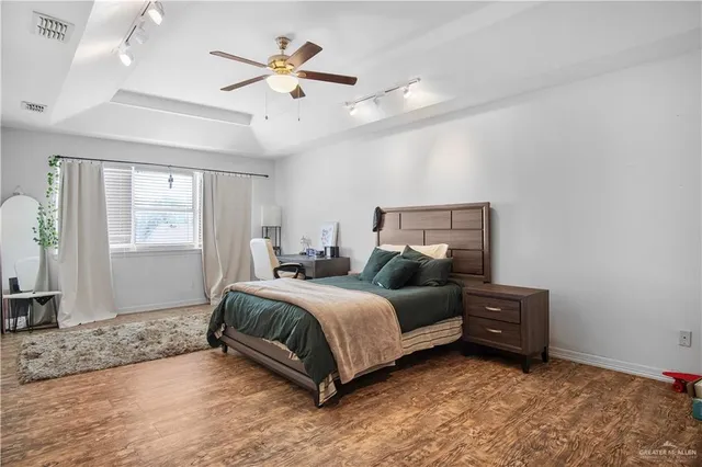 a bedroom with bed and window