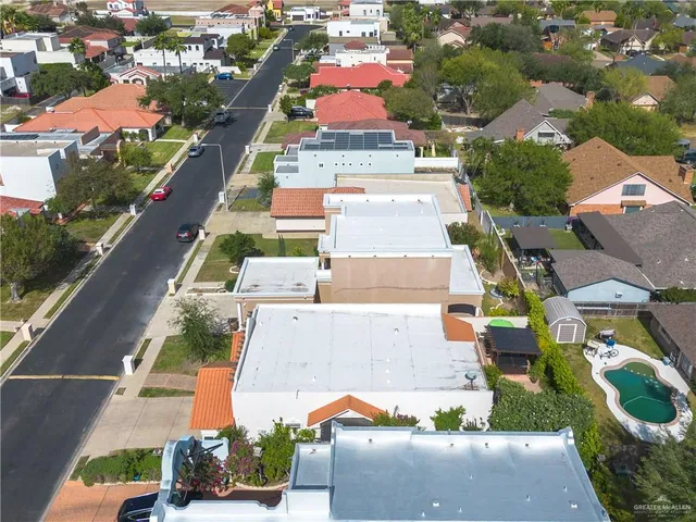 an aerial view of residential houses with outdoor space