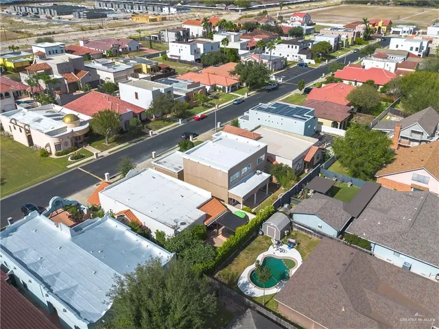 an aerial view of residential houses with outdoor space