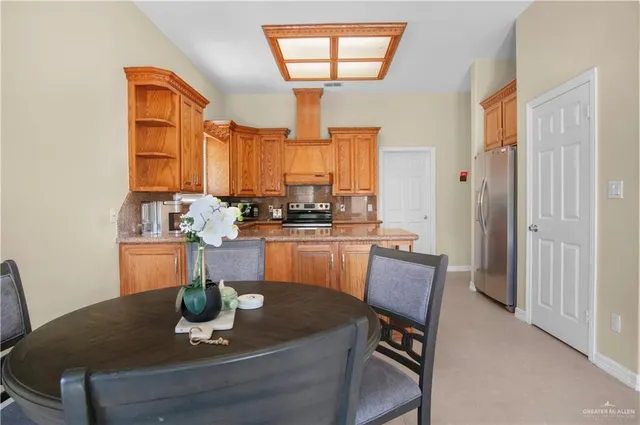 a dining room with furniture window and wooden floor