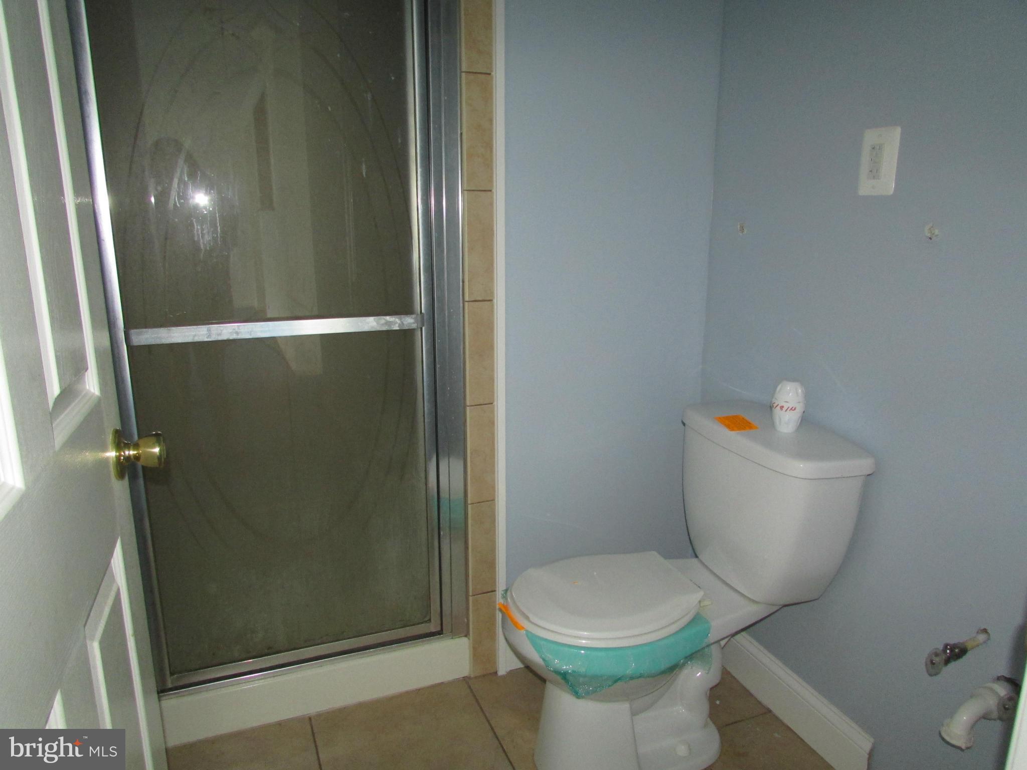 600 Meadow Road Baltimore, MD 21206 - Photo 7 of 13 a bathroom with a toilet and a shower
