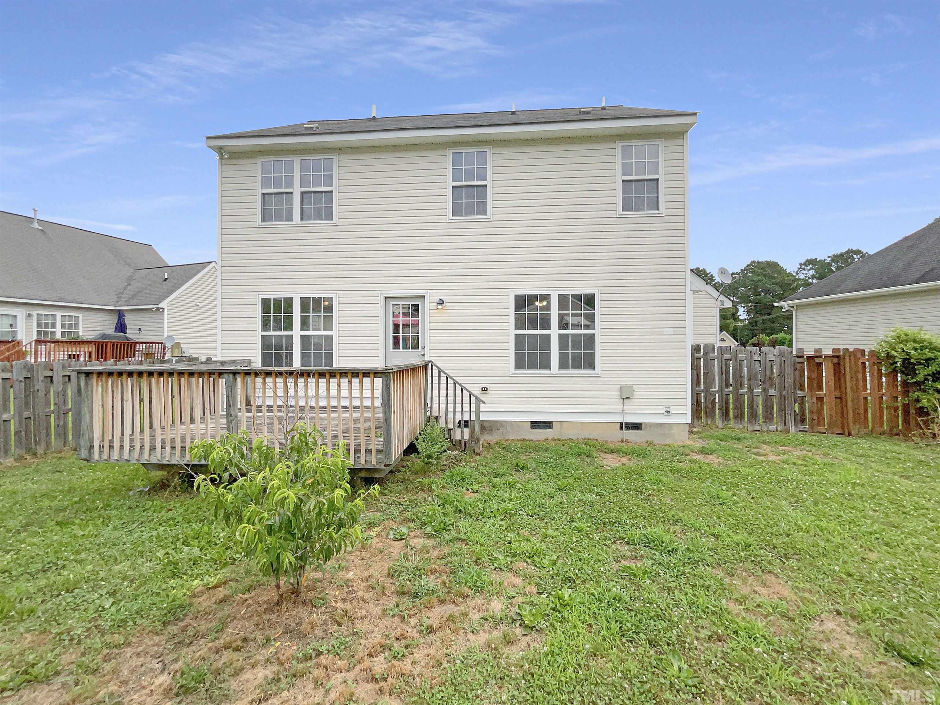 5720 Tealbrook Drive Raleigh, NC 27610 - Photo 15 of 17 a front view of a house with a yard