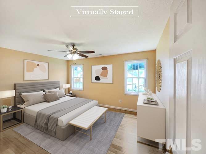 5720 Tealbrook Drive Raleigh, NC 27610 - Photo 16 of 17 a bedroom with a bed and a window