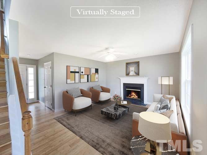 5720 Tealbrook Drive Raleigh, NC 27610 - Photo 17 of 17 a living room with furniture and a fireplace