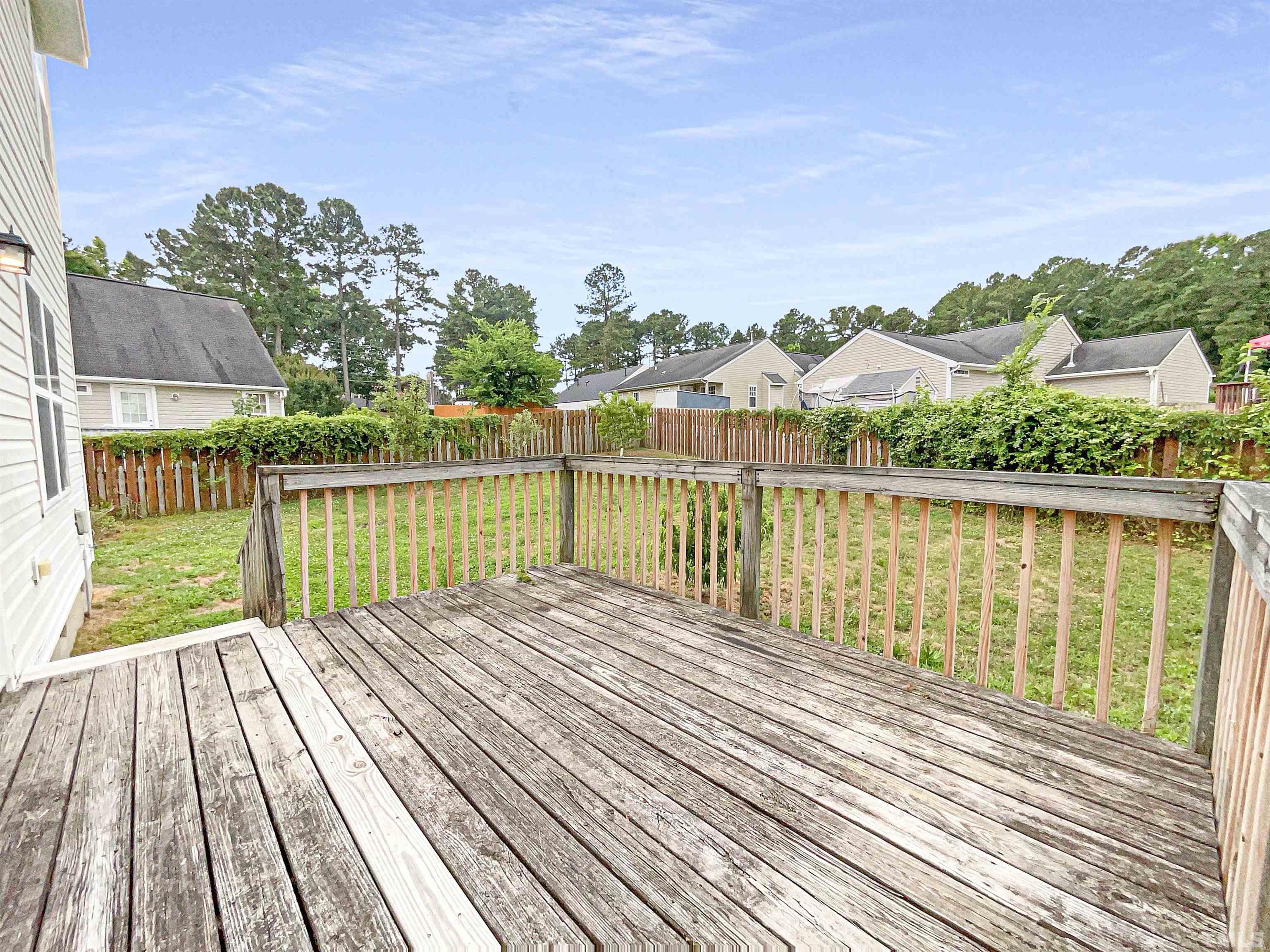 5720 Tealbrook Drive Raleigh, NC 27610 - Photo 5 of 17 a view of balcony with wooden floor & fence