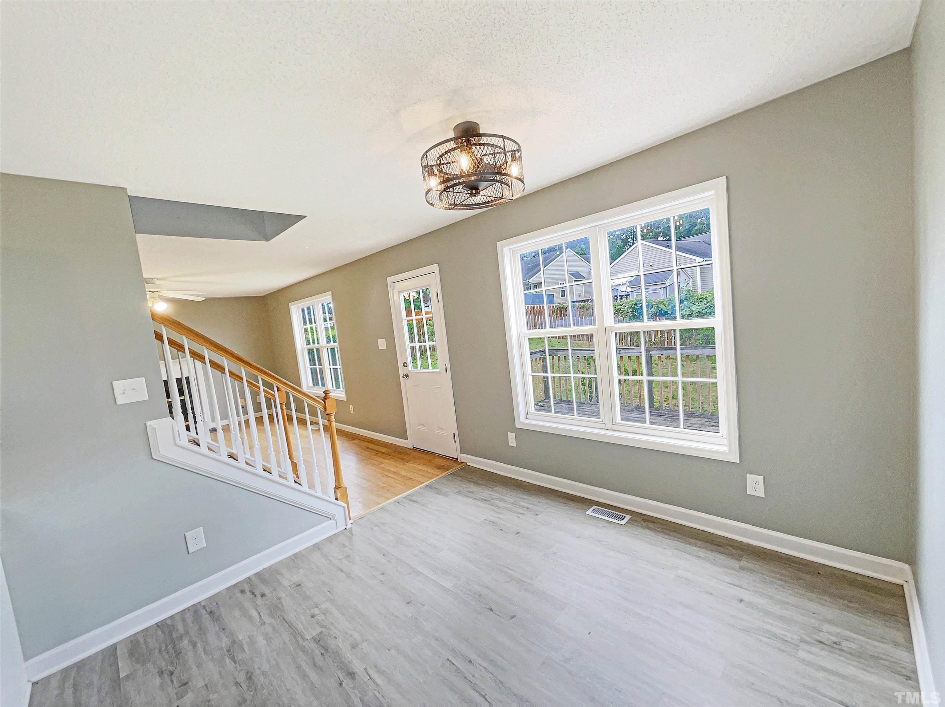 5720 Tealbrook Drive Raleigh, NC 27610 - Photo 8 of 17 a view of an entryway with wooden floor