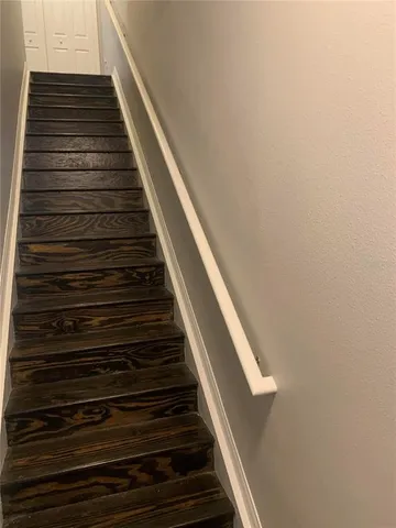 an empty room with wooden floor