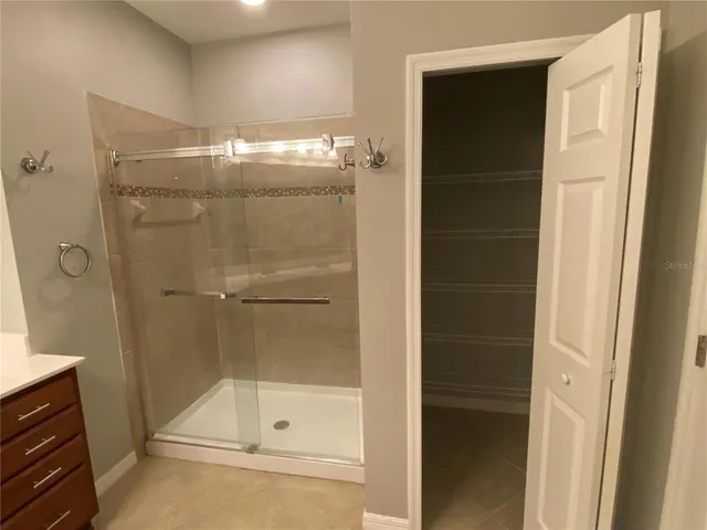 a white toilet sitting next to a bath tub