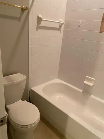 a view of a building with a yard