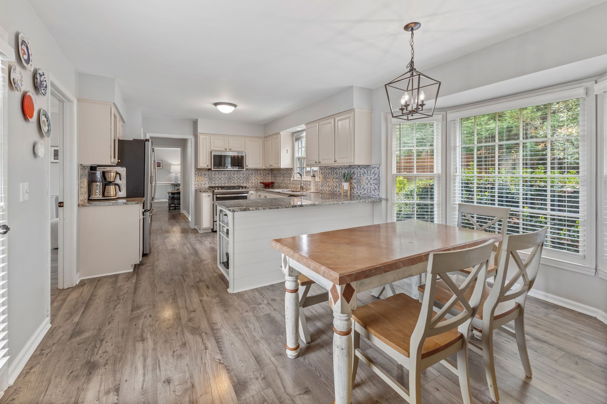1517 Pinkerton Road Brentwood, TN 37027 - Photo 16 of 49 a view of a dining room with furniture wooden floor and chandelier