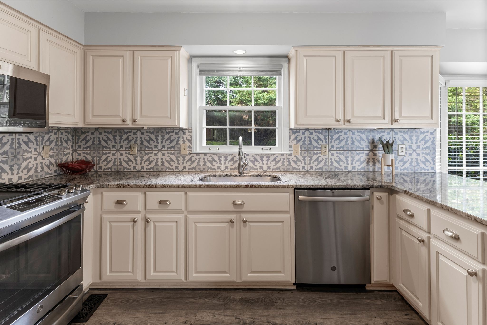 1517 Pinkerton Road Brentwood, TN 37027 - Photo 20 of 49 a kitchen with white cabinets appliances and a window