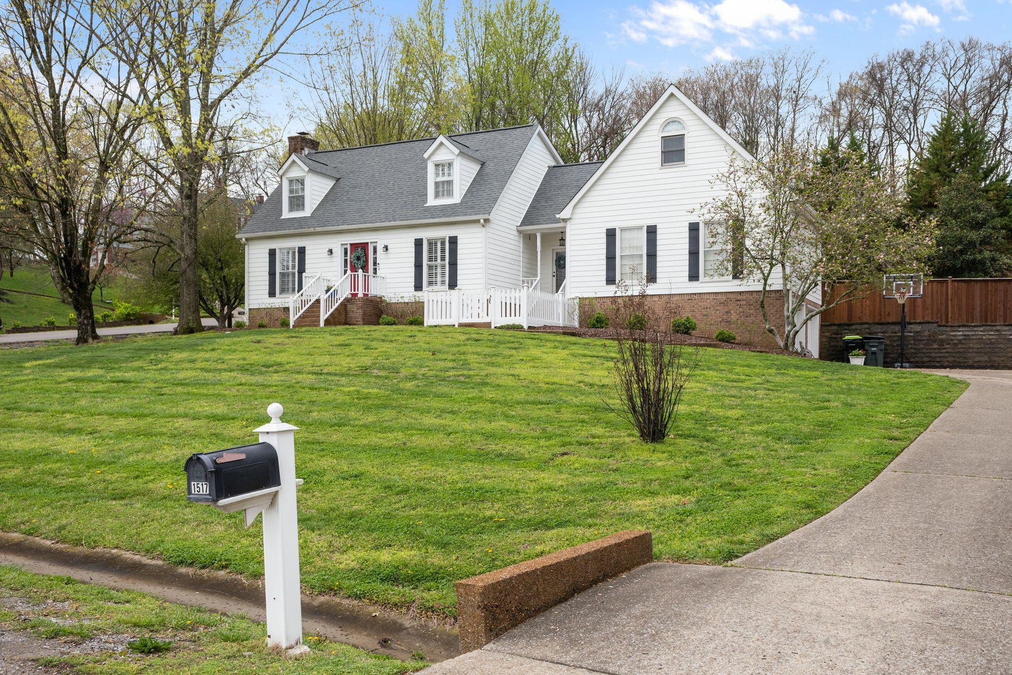 1517 Pinkerton Road Brentwood, TN 37027 - Photo 2 of 49 a front view of a house with a yard