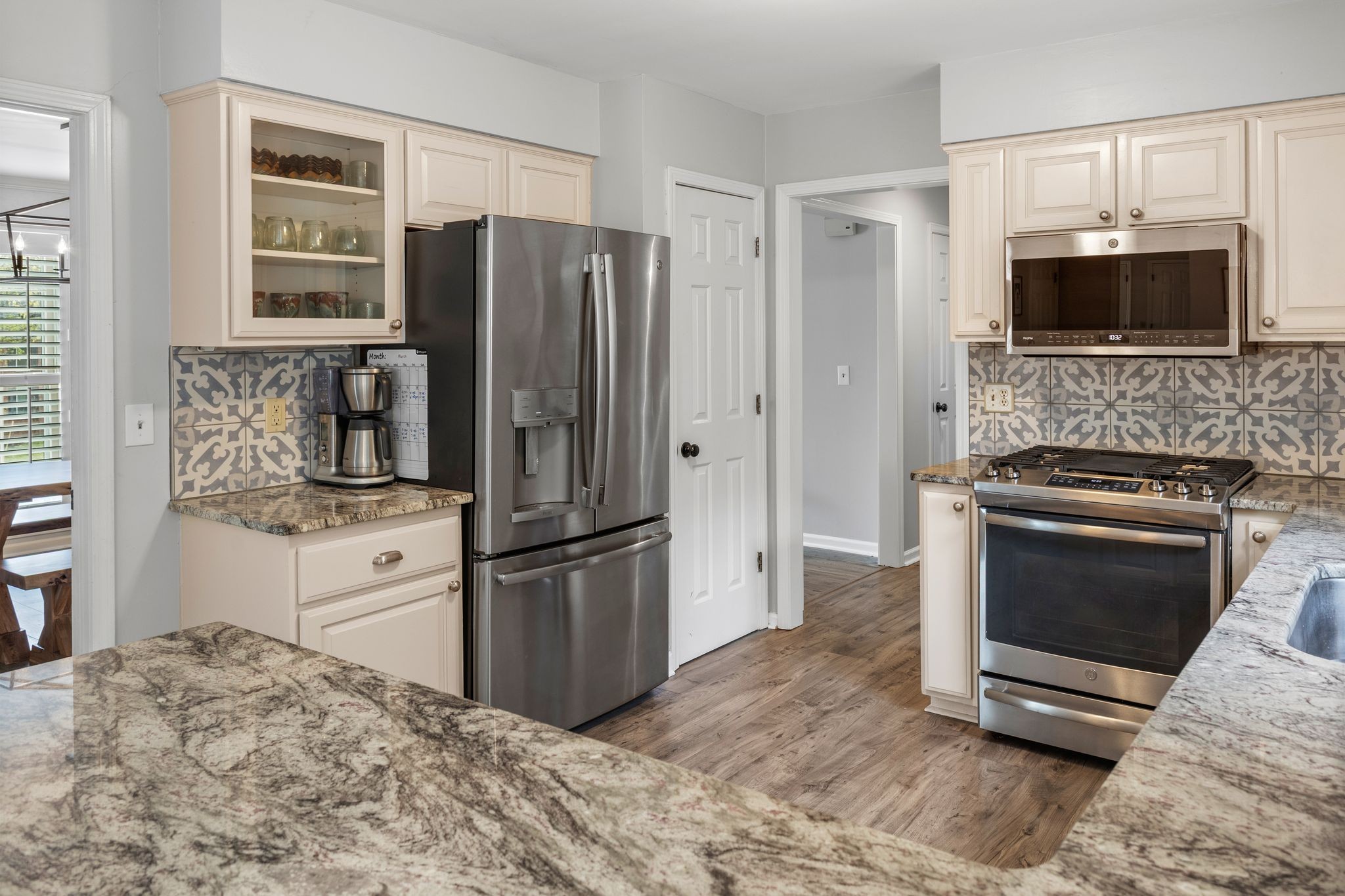 1517 Pinkerton Road Brentwood, TN 37027 - Photo 21 of 49 a kitchen with stainless steel appliances granite countertop a refrigerator stove and microwave