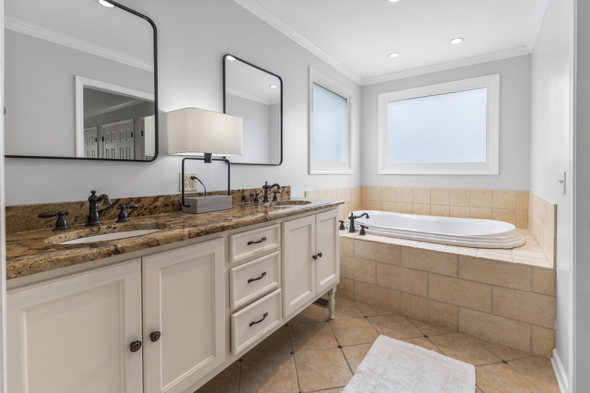 1517 Pinkerton Road Brentwood, TN 37027 - Photo 25 of 49 a bathroom with a granite countertop double vanity sink a mirror and a bathtub