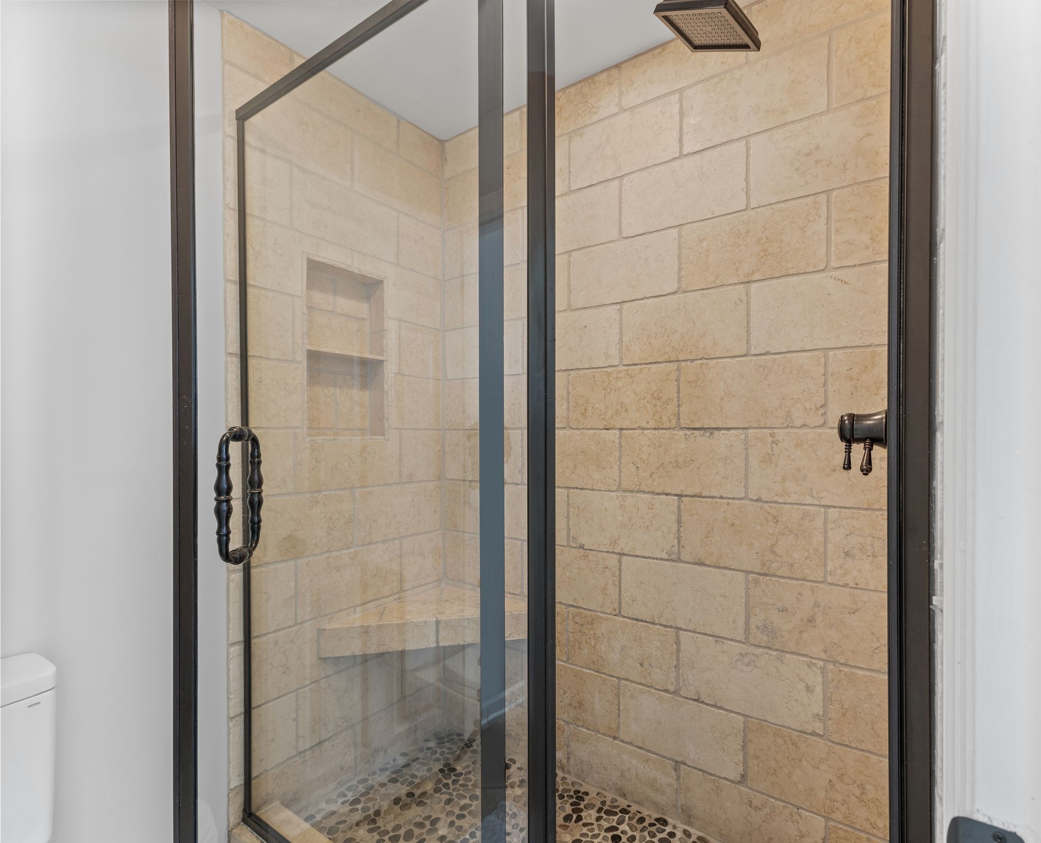 1517 Pinkerton Road Brentwood, TN 37027 - Photo 27 of 49 a bathroom with a glass shower door